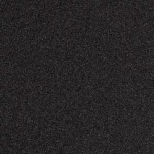 Zbliżenie na ciemnoszarą, ziarnistą powierzchnię o drobnych, nieregularnych kropkach.