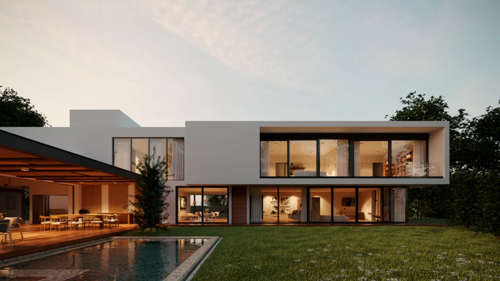 Nowoczesny, dwupiętrowy dom z dużymi przeszkleniami o zmierzchu; po lewej zadaszony drewniany taras z jadalnią, na pierwszym planie podłużny basen i trawnik, w tle drzewa.