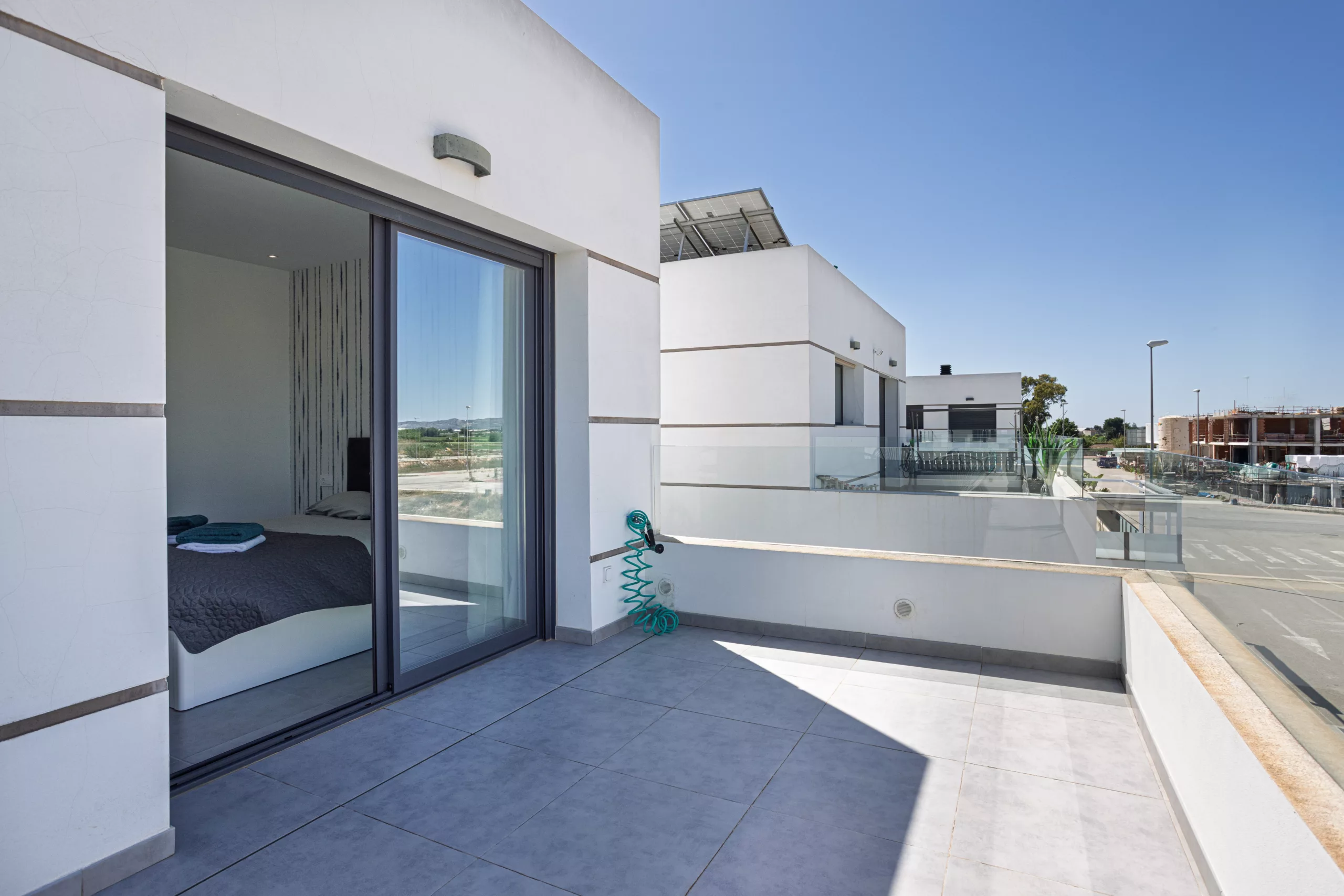 Terrace,View,With,Sliding,Door,Entry,From,Bedroom,,Overlooking,The